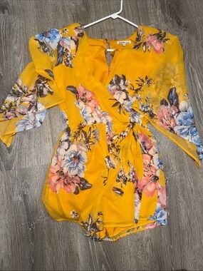 Charlotte Russe Yellow Floral Wrap Romper with Tie Waist